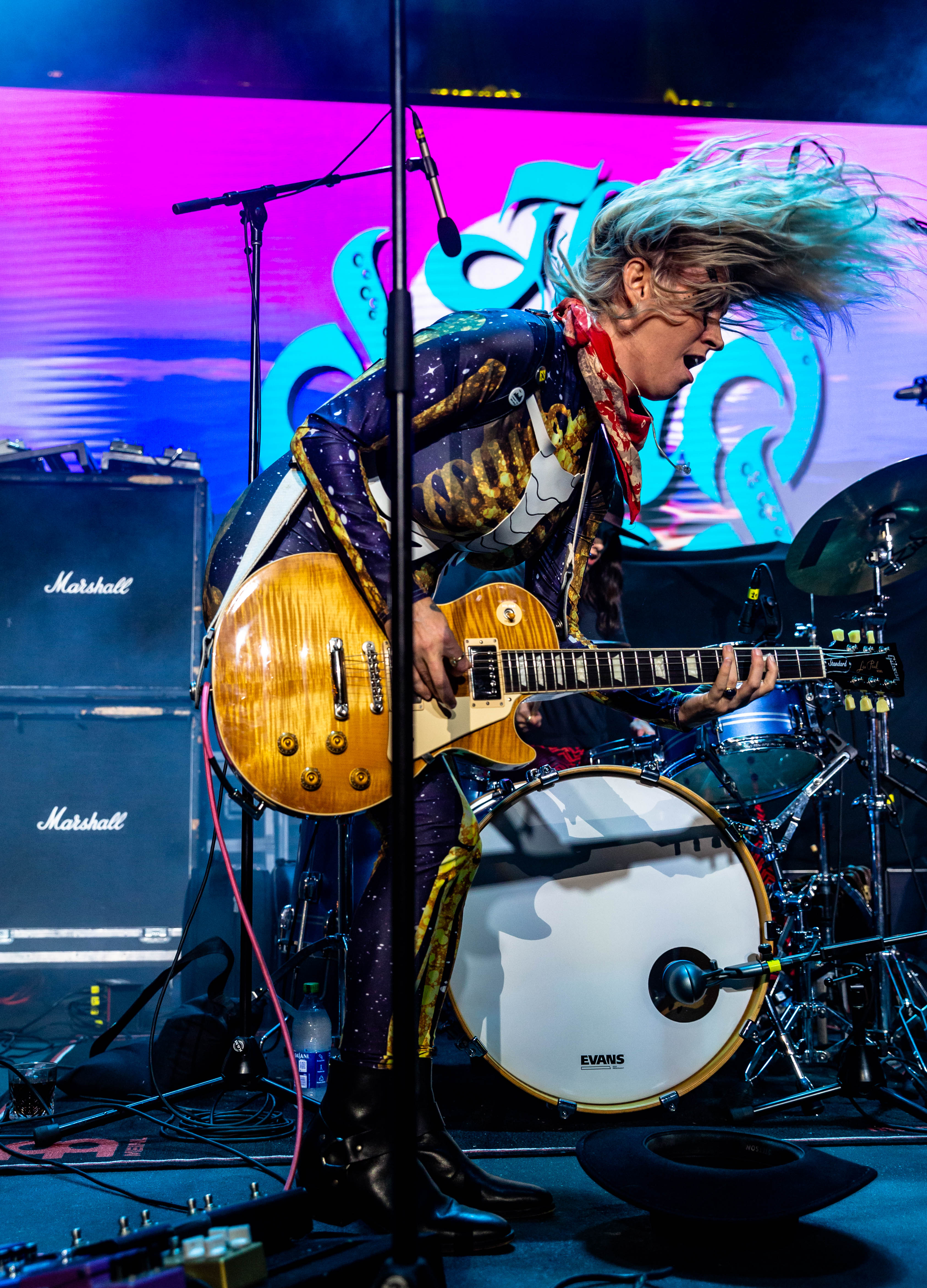 Mid-performance action shot with dynamic energy and movement